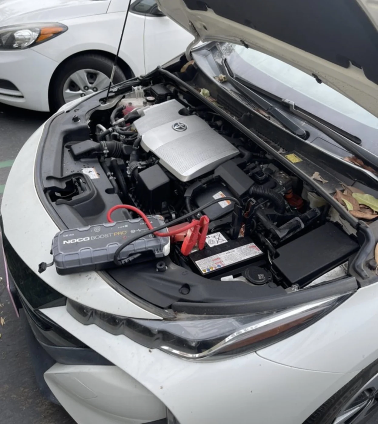 Automotive battery service at a parked car