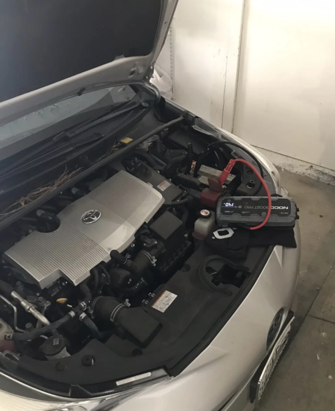 Battery service at a parked car